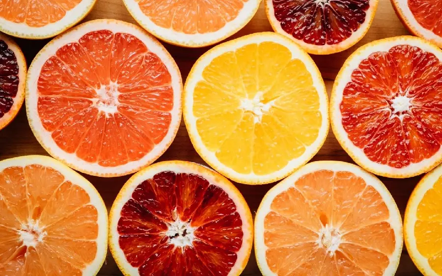 Delicious stock photo of beautiful grapefruits and useful oranges