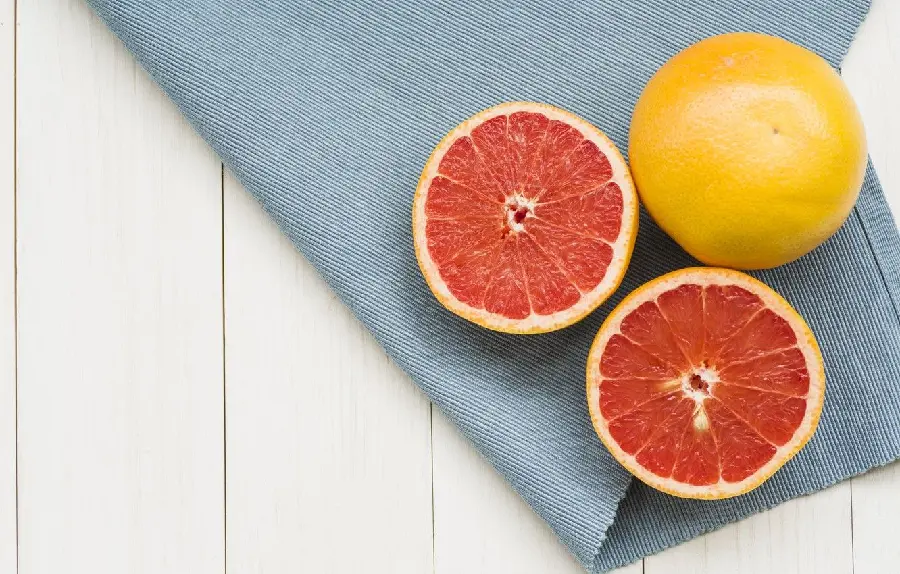 Attractive and stunning background of grapefruit fruit on fabric