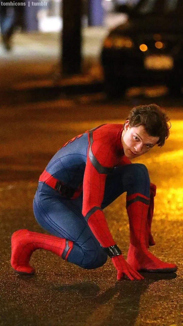 A simple photo with a blurred background of Tom Holland playing Spider-Man, suitable for mobile wallpapers