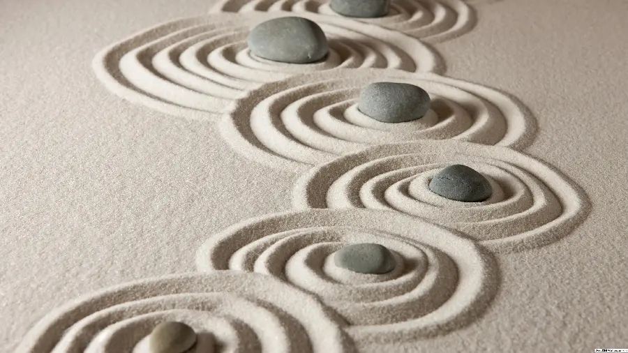 Image of circular waves made of stone and sand in a Zen garden for Wallpaper