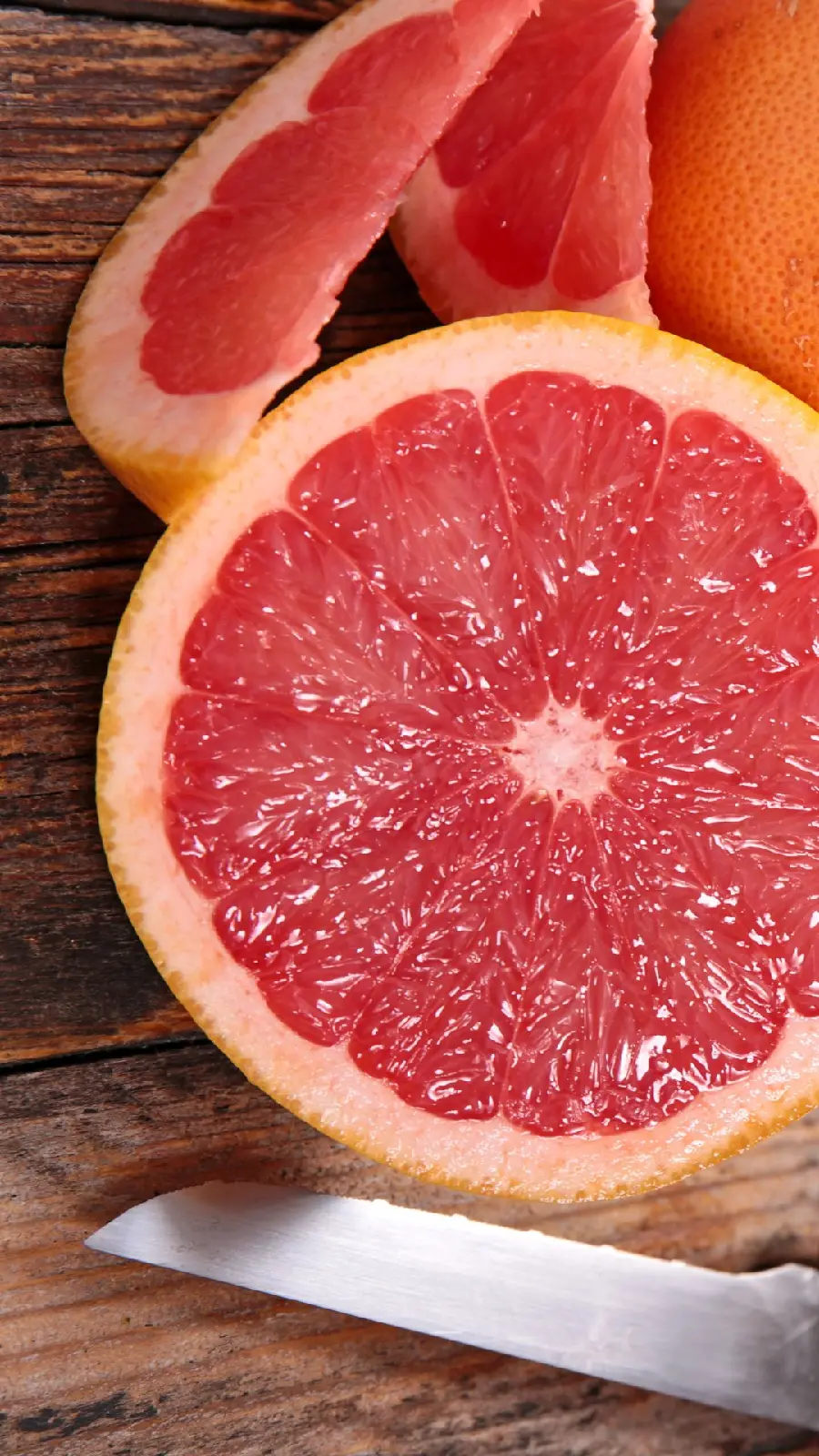 A beautiful and amazing story of cooking and grapefruit and a knife on a cutting board