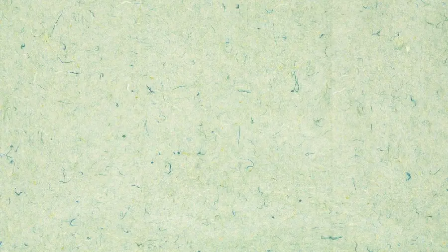 Simple design with a pale green pattern with small blue streaks and yellow spots