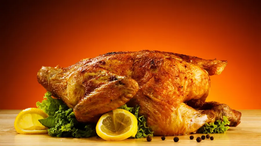 Delicious photo of a chickenLow-fat and roasted with vegetables and lemon 