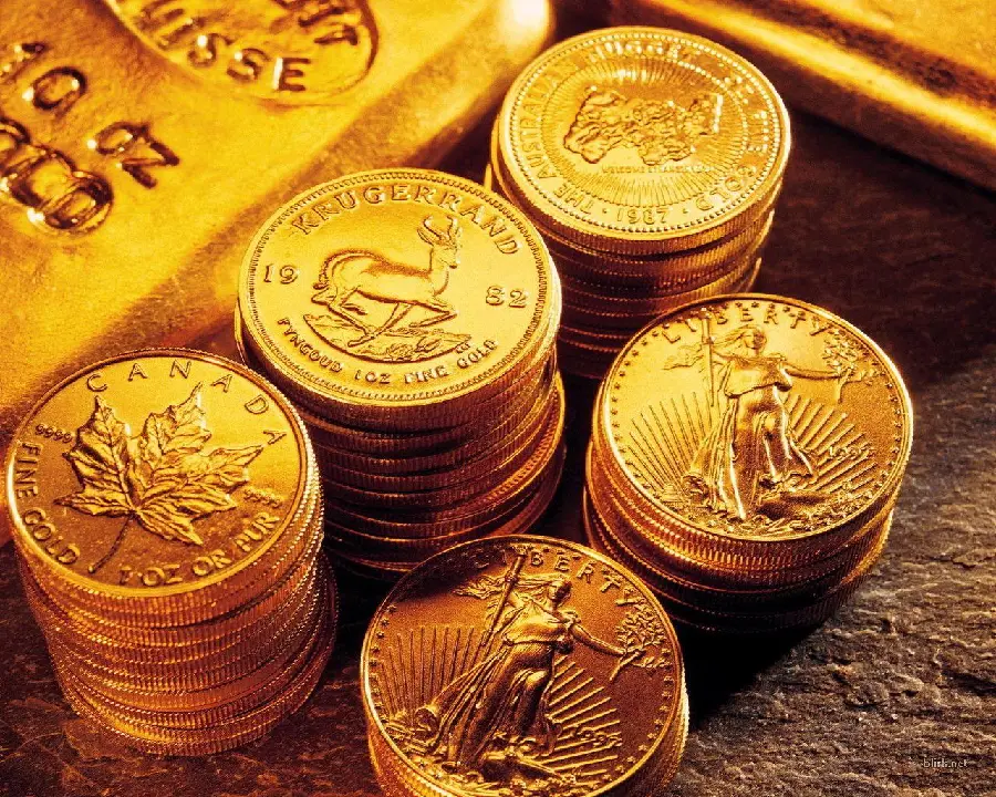Background photo of neatly arranged gold coins next to gold bars 