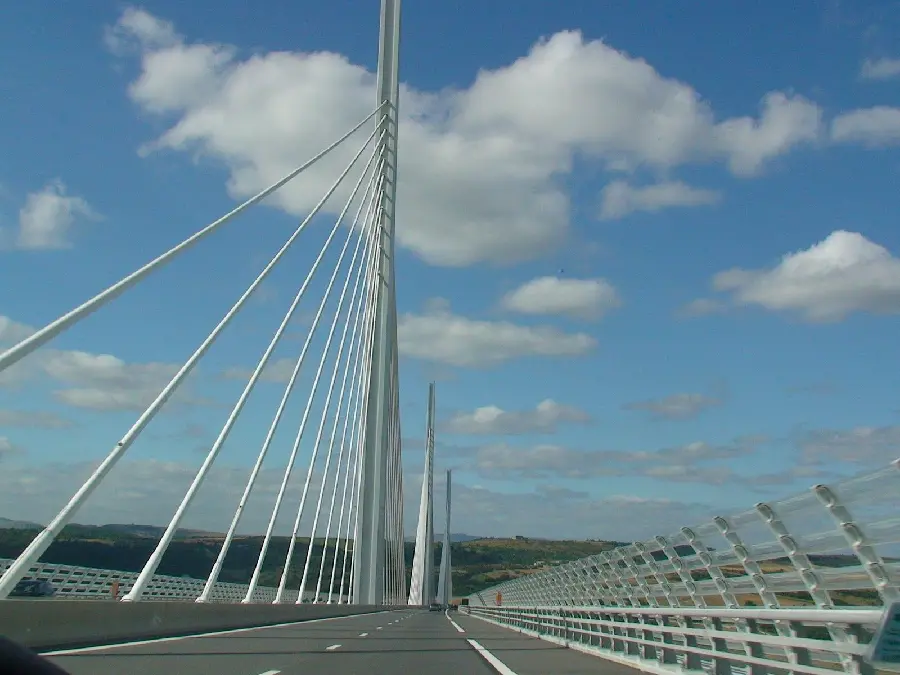 Amazing wallpaper of the Millau Bridge in France with beautiful clouds in the sky 