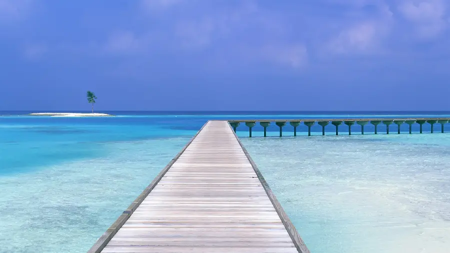 A stylish image of the endless blue sea and a beautiful wooden bridge in excellent quality