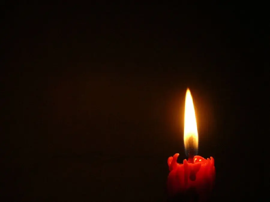 Photo of a bright red candle for condolences to express feelings to the survivor 