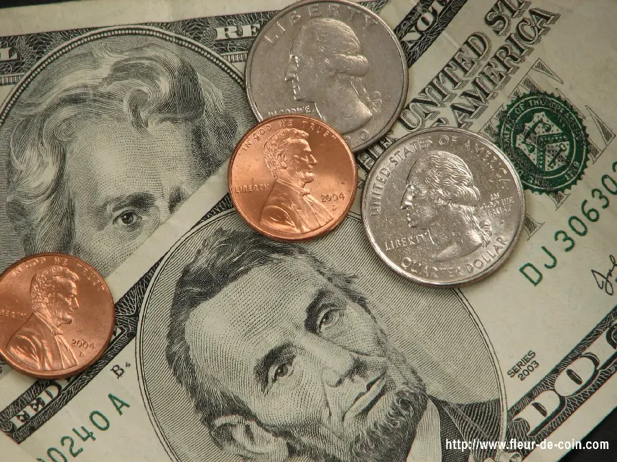 Free and high-quality photo of gold coins and US dollar banknotes 