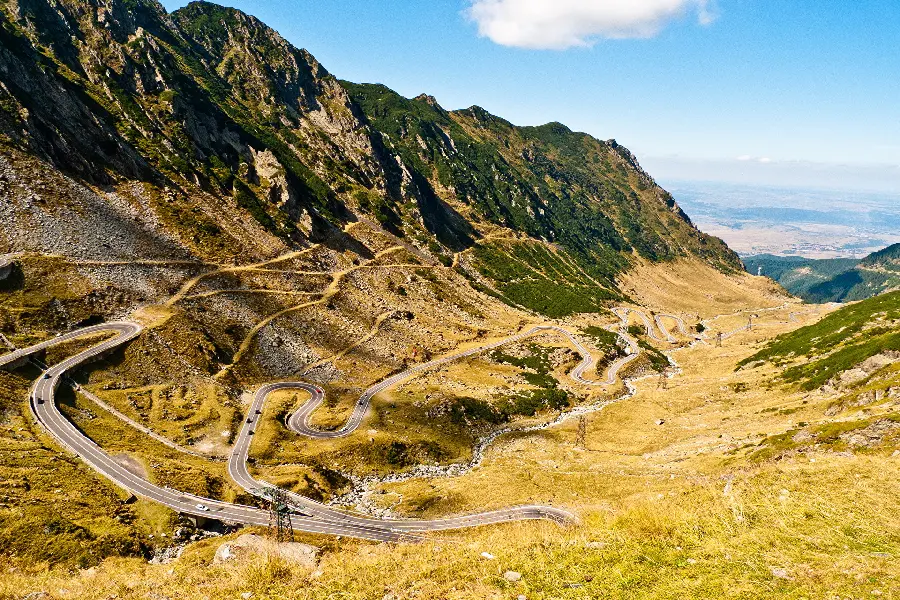 The newest wallpaper of a dreamy road on the slopes of the green mountain