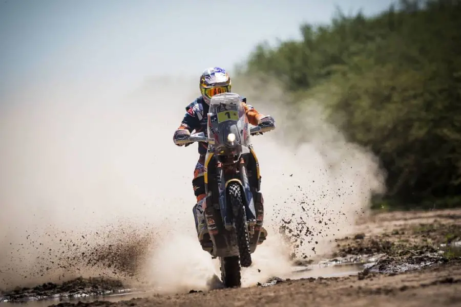Background photo of motorcycle riding in the Dakar Rally series for sports lovers' laptops