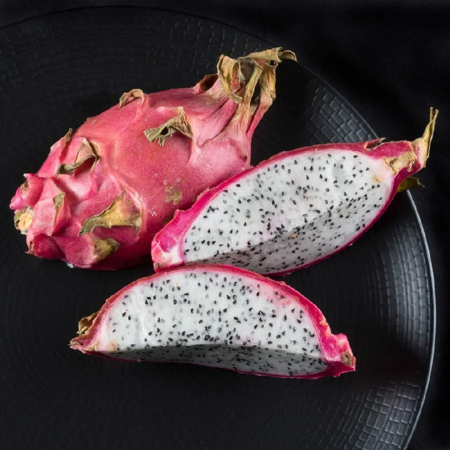 Image of sliced ​​dragon fruit in a luxurious black container for advertising posts