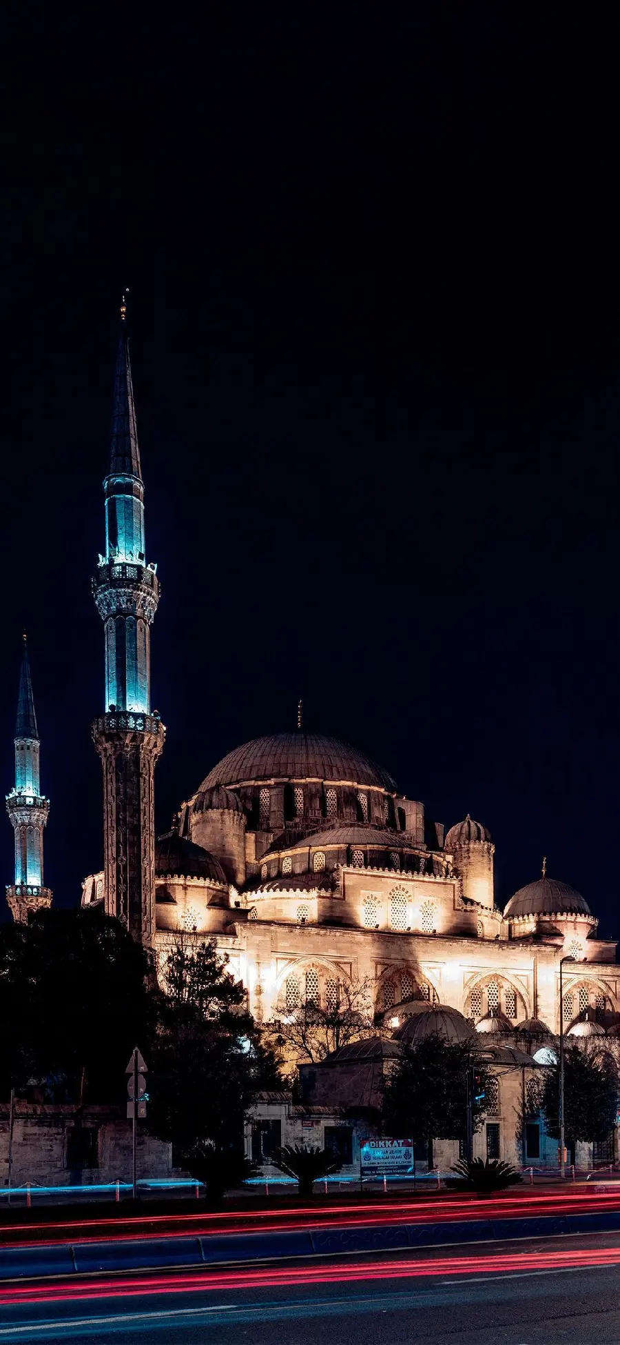A unique wallpaper of a beautiful mosque with bright lights 