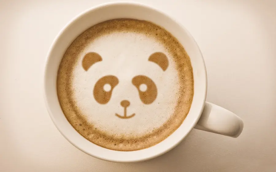 Stock photo of panda coffee in a porcelain cup for professional graphic designers of graphic cafes