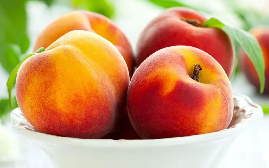 cool and sweet peach fruit background in a container for your computer