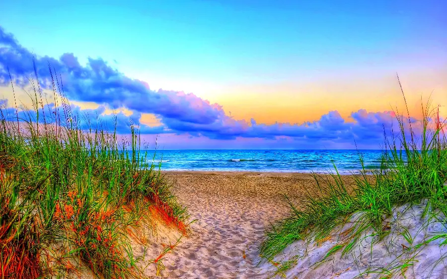 Image of a beautiful seashore in summer with an extremely beautiful combination of water, clouds and soil colors