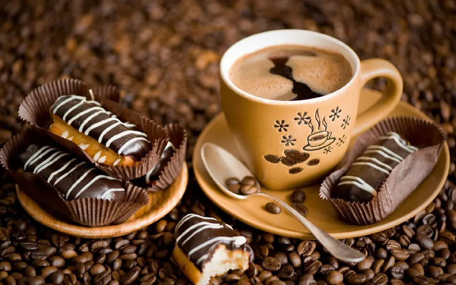 Amazing background of delicious coffee and beautiful chocolate sweets