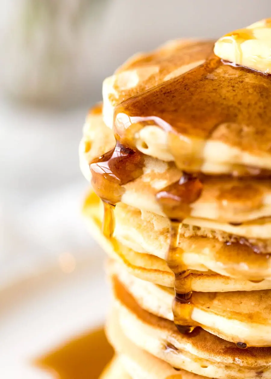 Photo of a delicious pancake Multi-layered fluffy honey pancake 