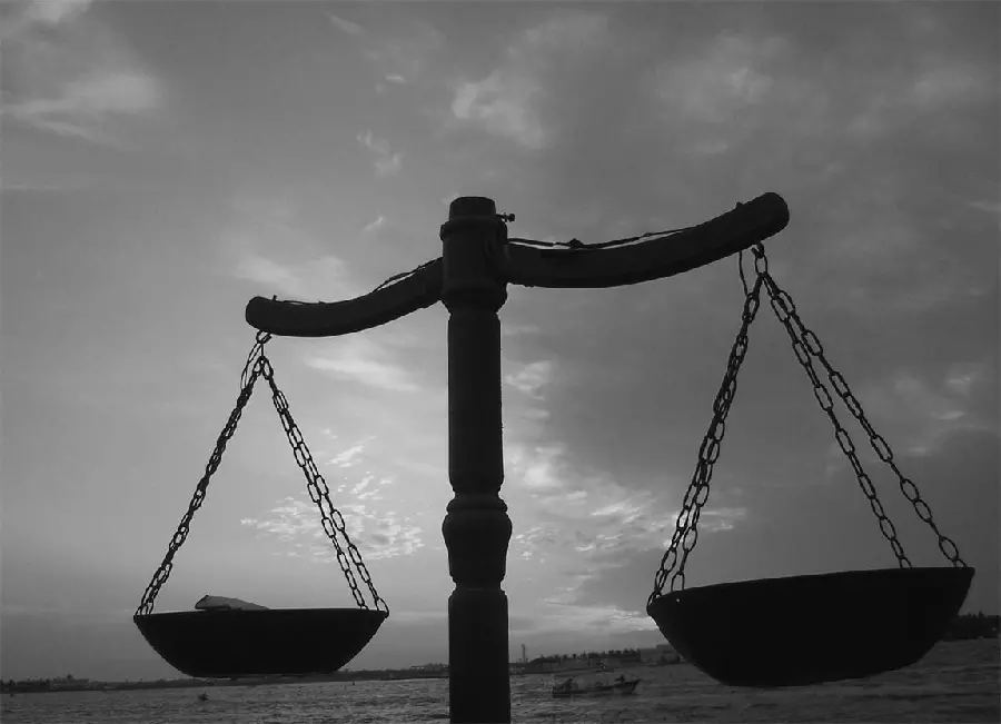 Black and white image of the scales of justice in an equal position with Good quality