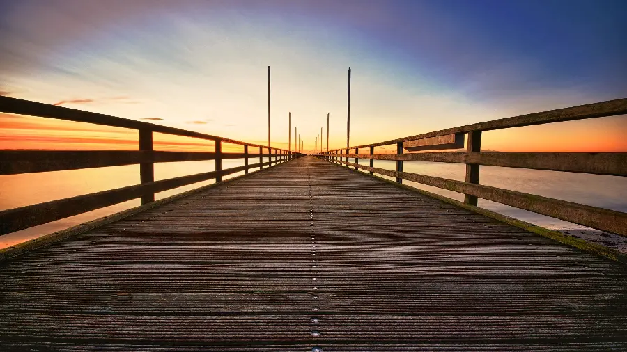 A very amazing picture of an infinite wooden bridge and a dreamy sky