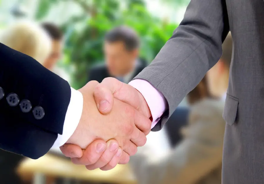 Download a high-quality photo of men shaking hands for free 