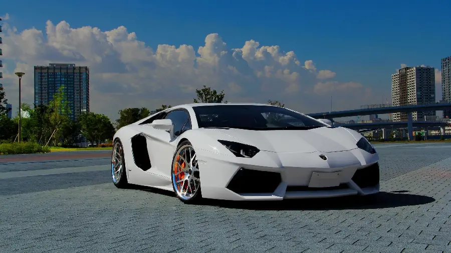 Background of Lamborghini sports car next to tall buildings 