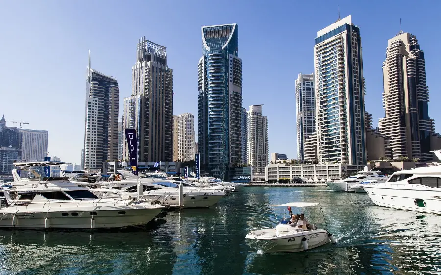 Stock image of lake ships and tall towers 