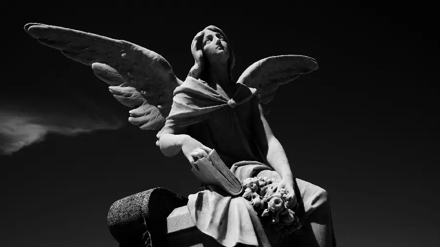 Photo of a stone statue of a winged angel with the highest quality
