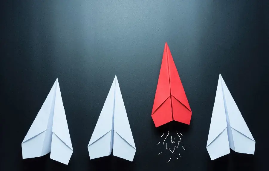 The most attractive laptop background of a white and red paper rocket