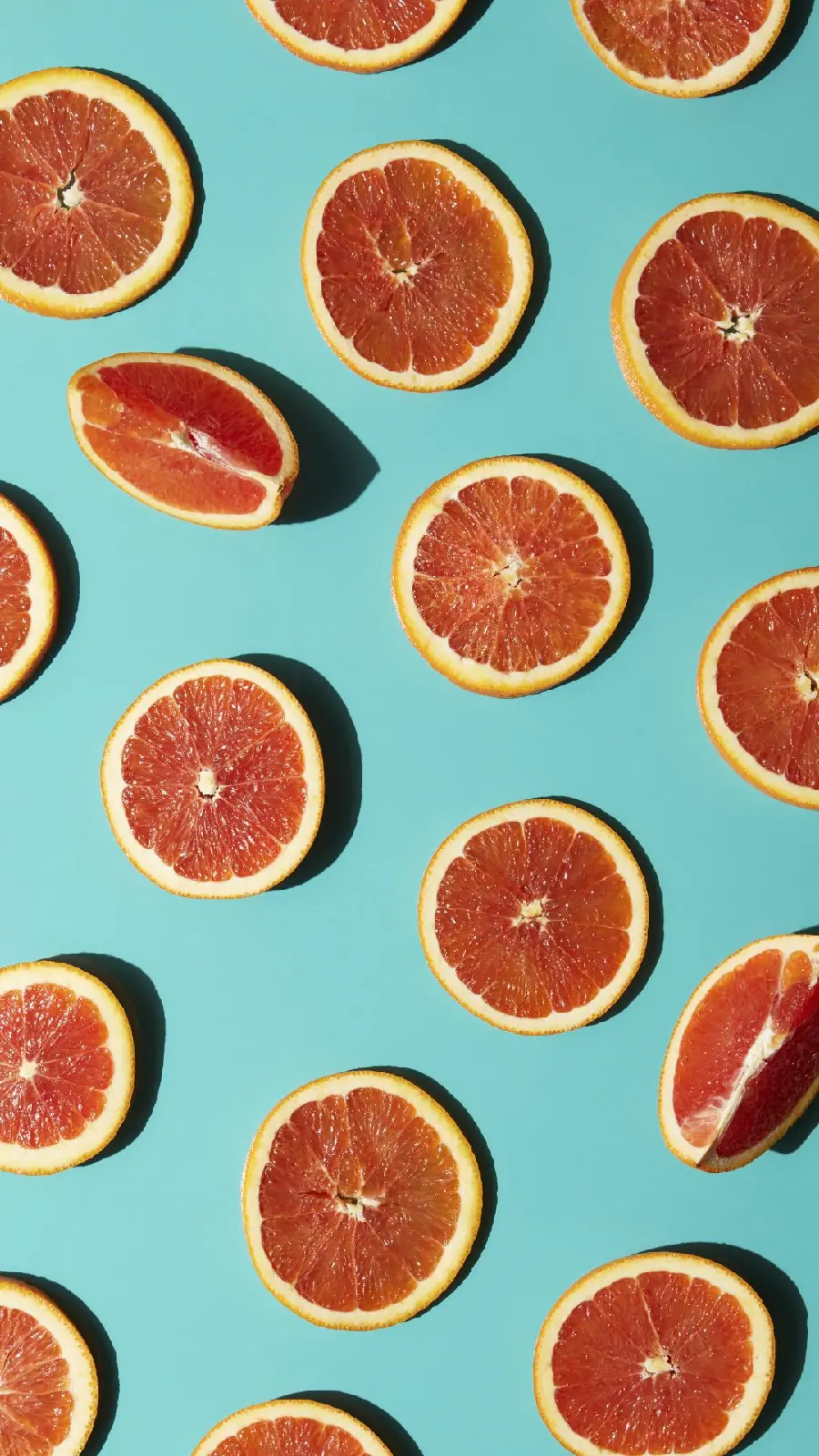 Portrait of beautiful grapefruits on a blue background