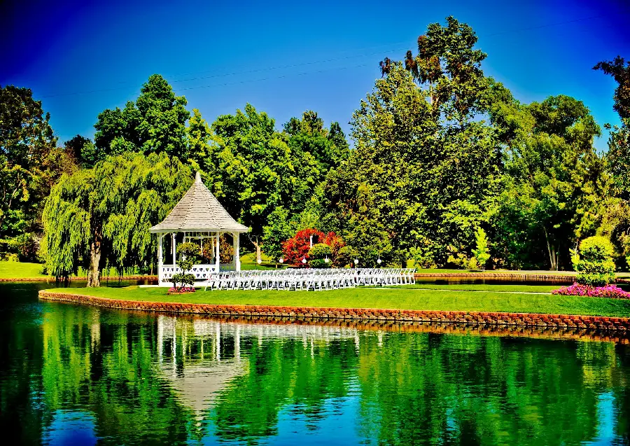 Photo of a small and classic garden hall in the heart of lush summer nature with full hd resolution