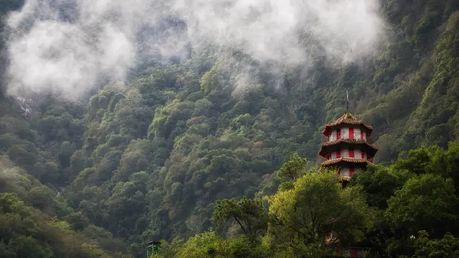 Very beautiful photo of a red and white house in the forest with excellent quality 