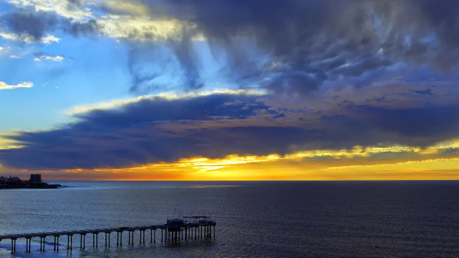 A spectacular stock photo of an endless sea and soft clouds