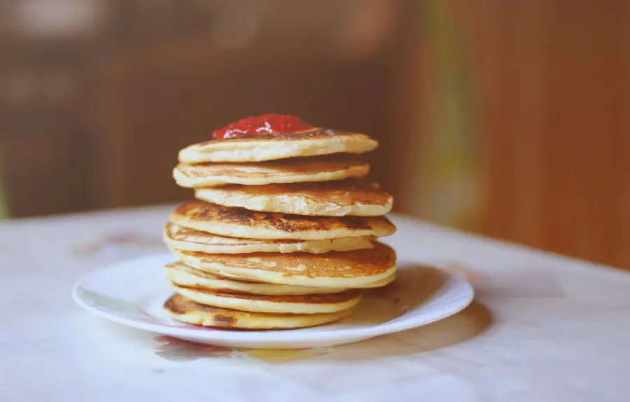 The most delicious breakfast in the world, American pancakes with strawberries 