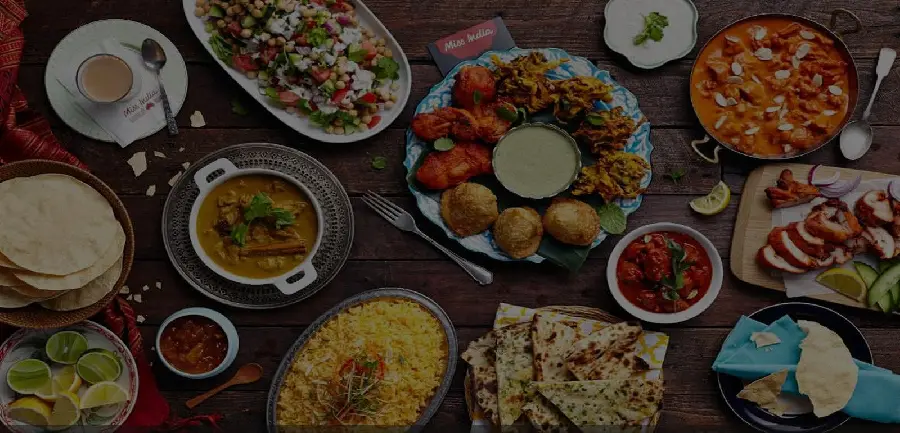 A dark and ready-to-write photo of a variety of Iranian and traditional restaurant food