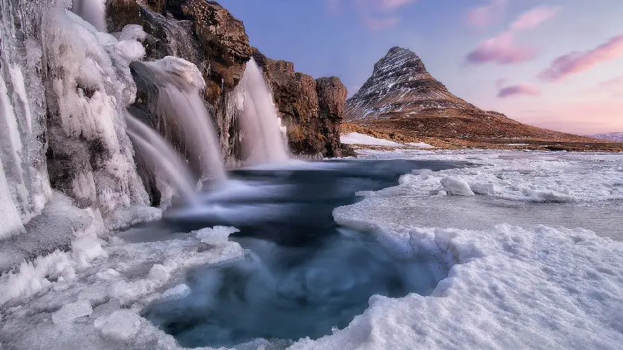 A stunning wallpaper of a waterfall that captivates every viewer