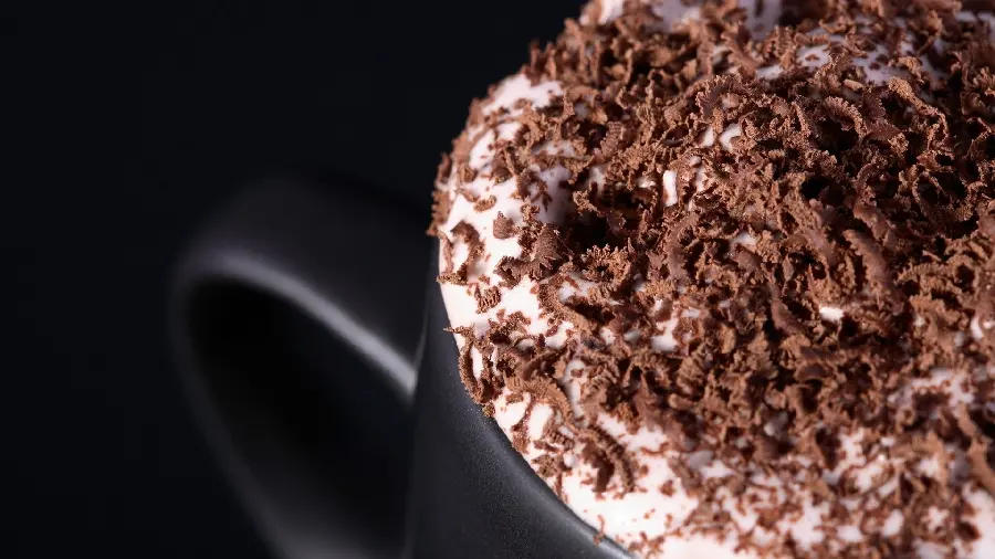 Attractive and delicious photo of cappuccino with cocoa 
