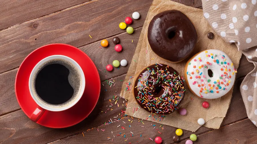 Incredibly beautiful wallpaper of chocolate donuts with coffee 