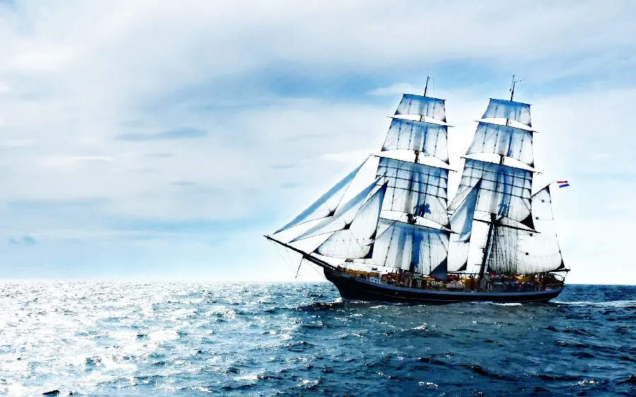 Luxury laptop background with an attractive Dutch ship design with stretched sails