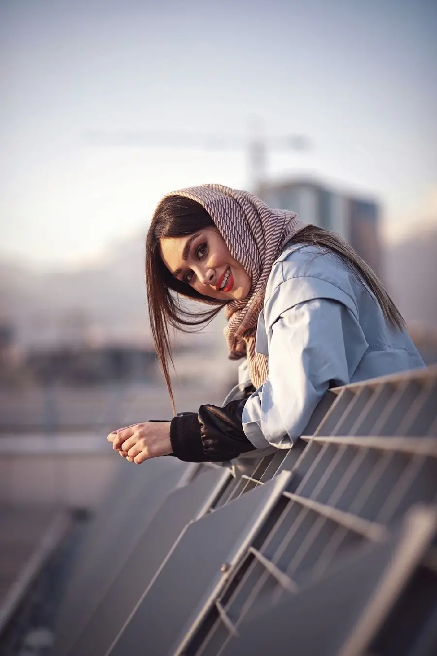 Classy background of a young girl with a scarf in a beautiful pose from the side 