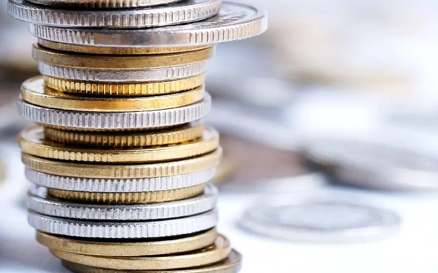 Photo of various gold and silver coins of the US and Canada dollar 