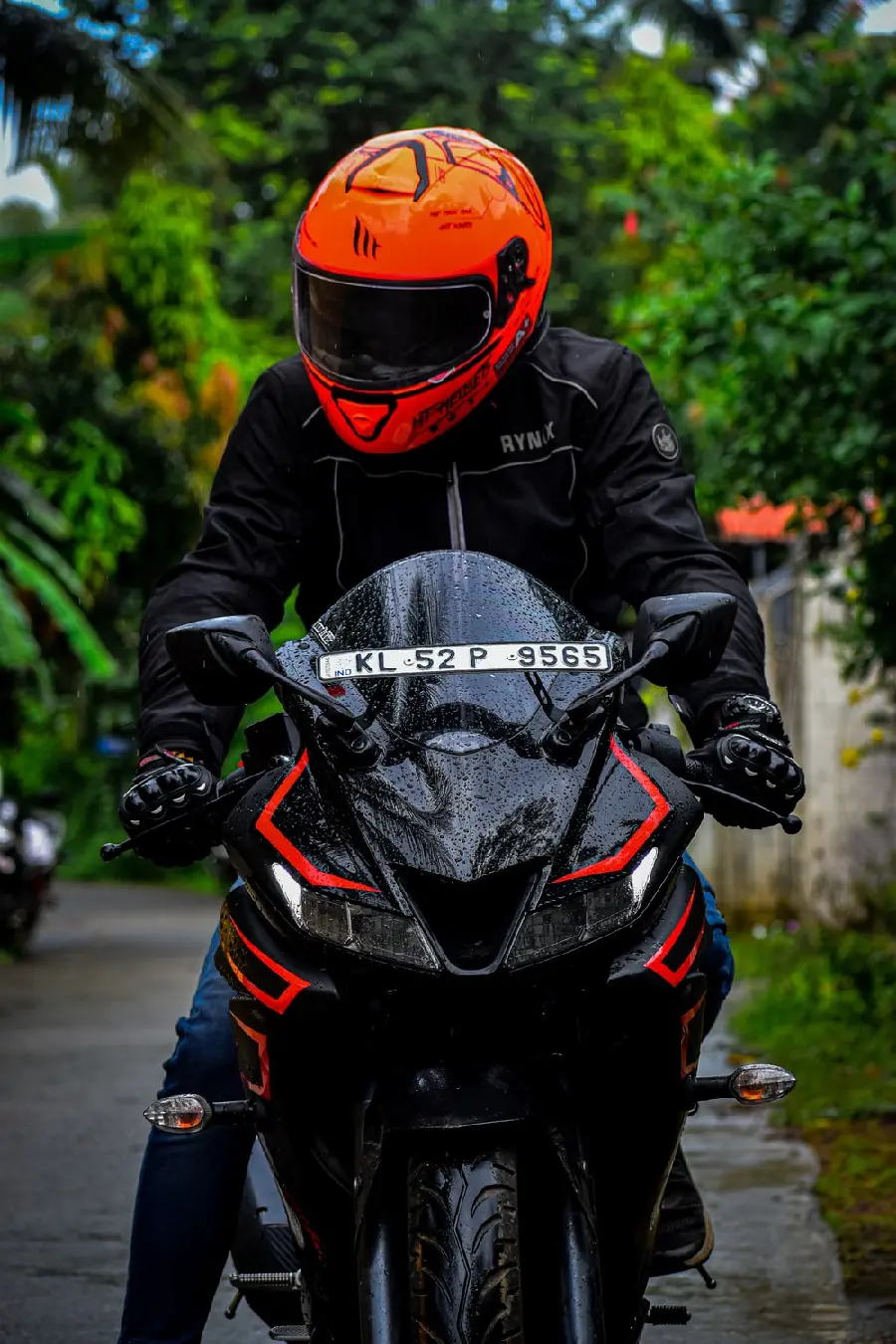 Dream photo of a motorcycle rider with a special red and black helmet and gloves