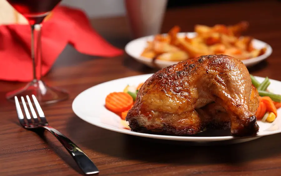 A delicious and tasty chicken food poster on a luxury restaurant table