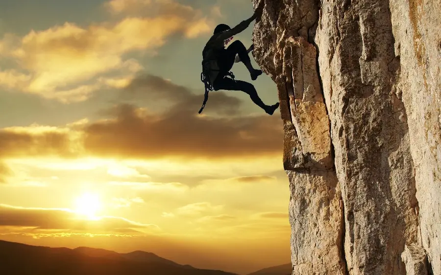 Very attractive photo of a strong and brave rock climber for the post