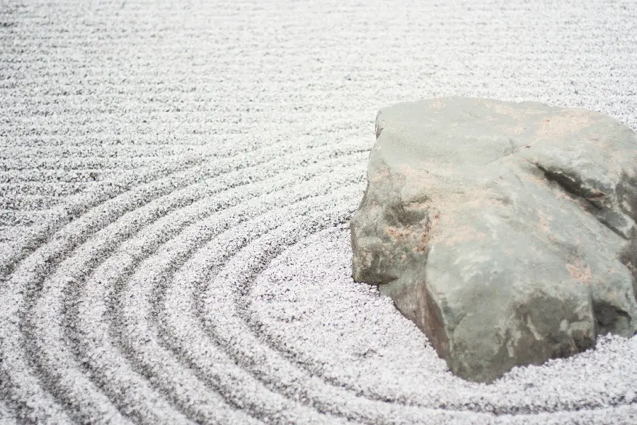 Zen Garden Phone Wallpaper with Lovely Stone and Sand Design
