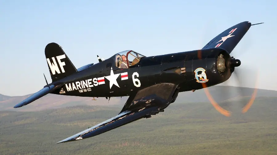 Download a photo of an interesting black plane with a propeller in the old days