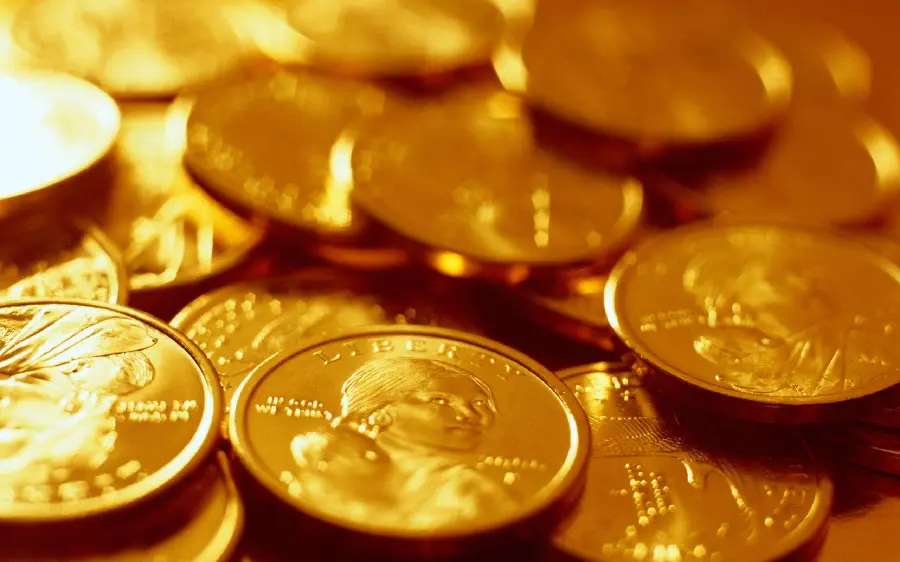 Download a beautiful image of gold coins on top of each other for your phone 