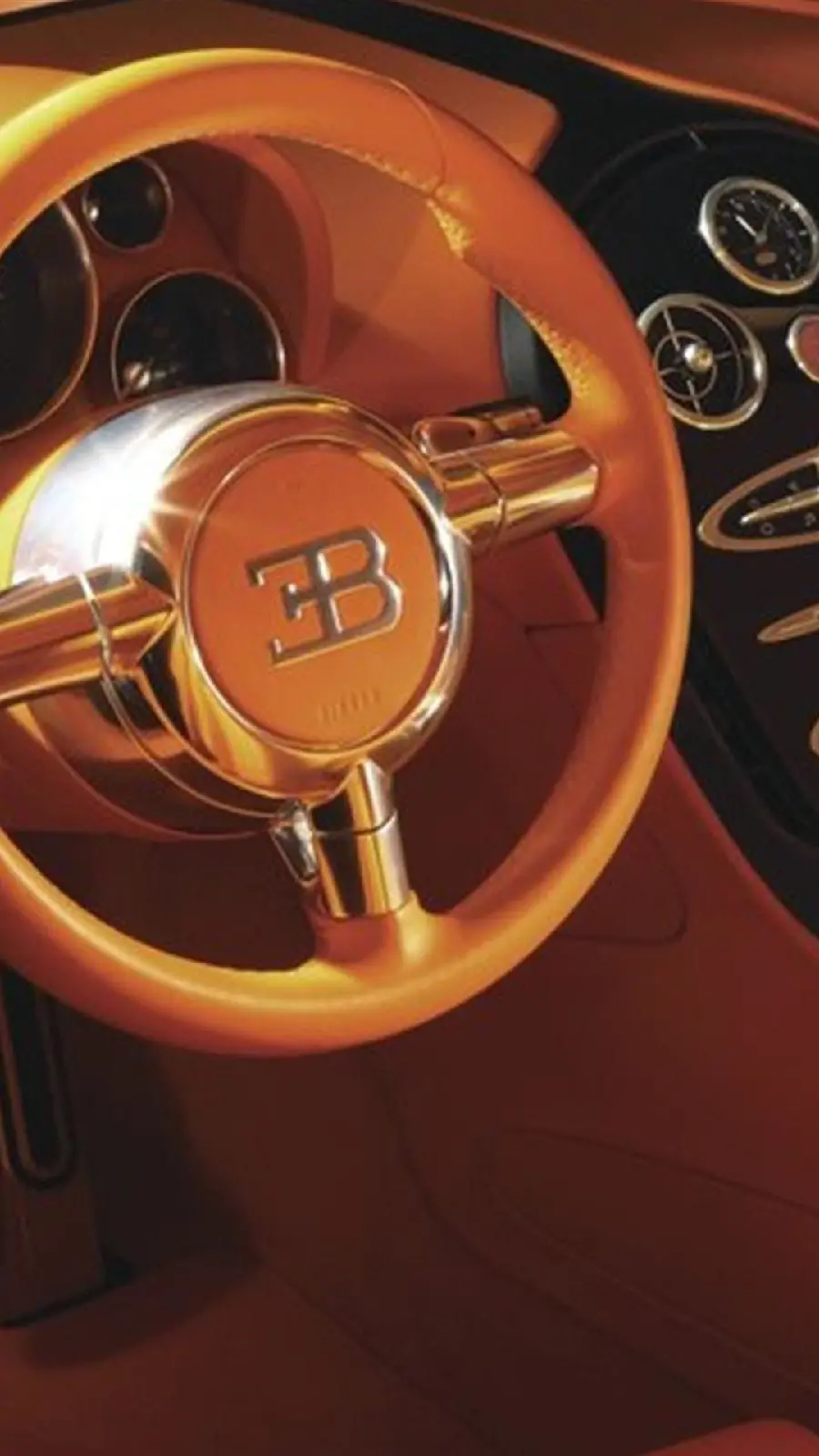 Full HD Photo of a Shiny Gold Steering Wheel on a Bugatti
