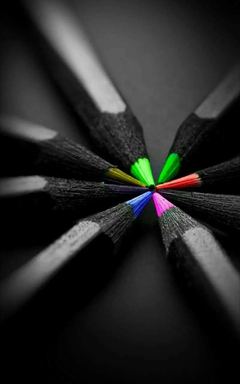 A charming and spectacular picture of beautiful colored pencils with a black coating 