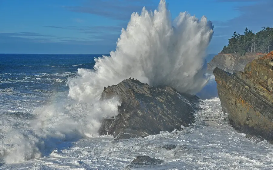 Amazing stock photo of sea waves hitting a piece of rock