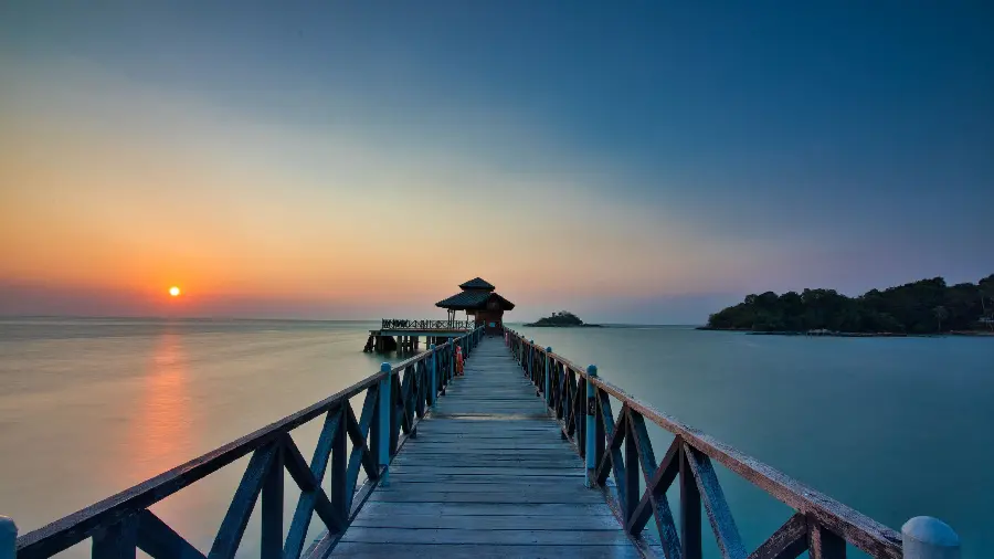 Download background depicting a charming sunset and an endless bridge